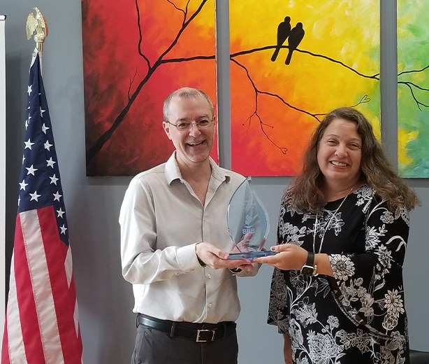 James Clemens of Mica Specialties receiving the 2021 BBB Torch Award for Ethics from Christine Jones of the BBB