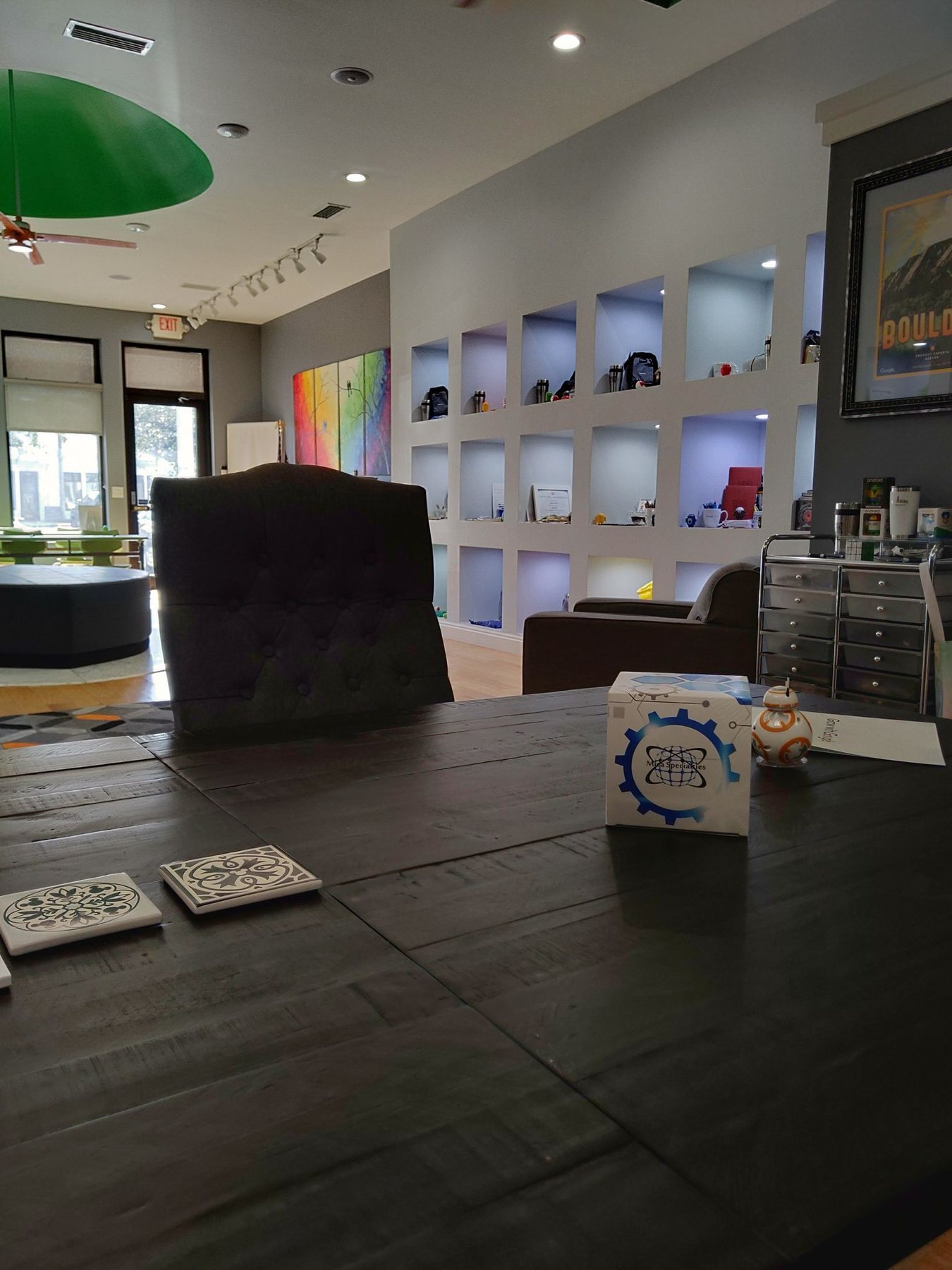Inside the Mica Specialties office: conference table, client lounge and display wall