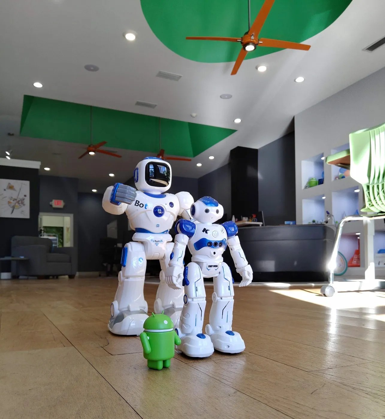 Two robots and an Android figure in the Mica Specialties lobby